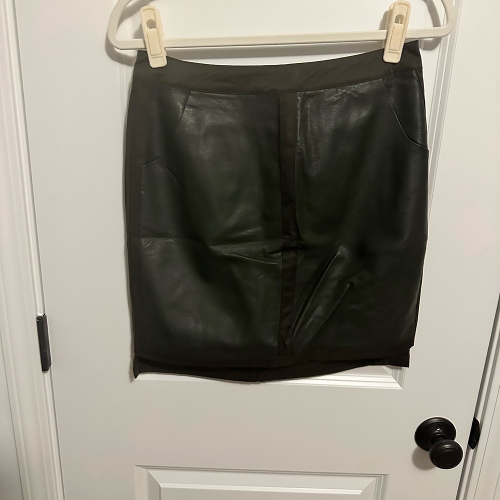 Faux leather dark green w/black trim skirt